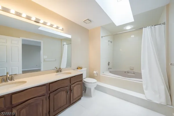 a bathroom with a bathtub and a toilet