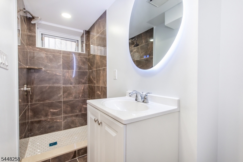 570 Cameron Road South Orange, NJ 07079 - Photo 31 of 32 a bathroom with a sink and a mirror