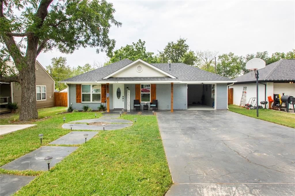 106 South 4th Street Celeste, TX 75423 - Photo 1 of 28 a view of a white house with a small yard plants and a large tree
