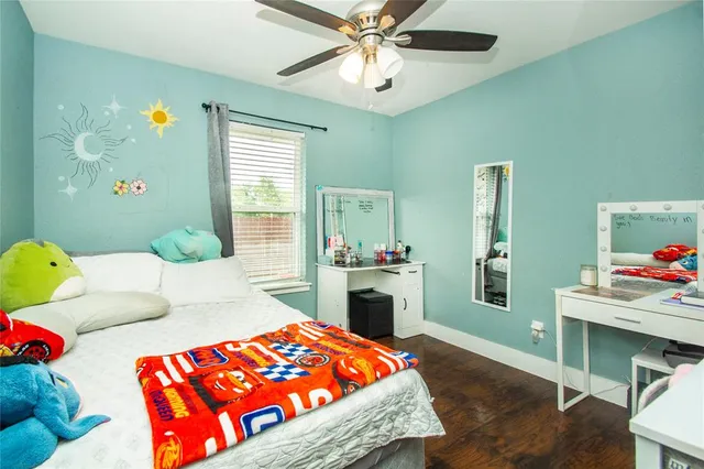 a bedroom with a bed and a table in it