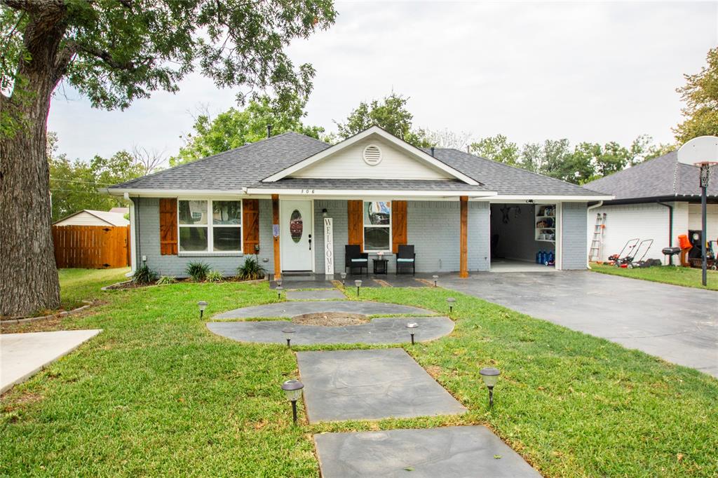 106 South 4th Street Celeste, TX 75423 - Photo 2 of 28 a view of a house with a yard and sitting area