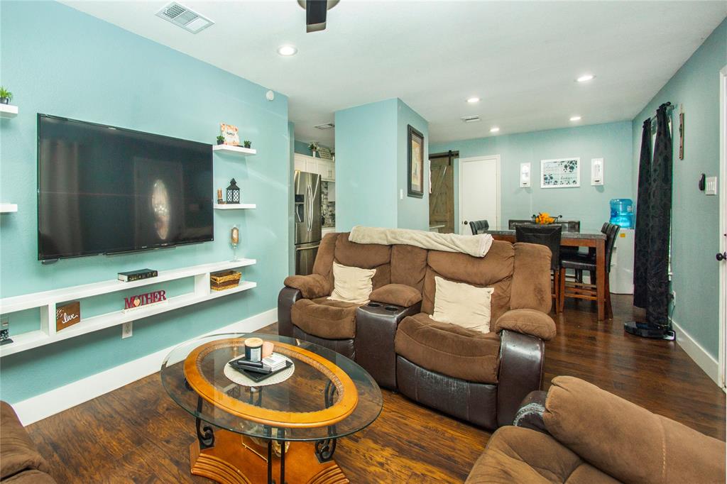 106 South 4th Street Celeste, TX 75423 - Photo 9 of 28 a living room with furniture and a flat screen tv