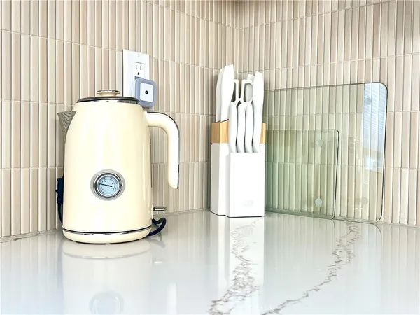 a kitchen with sink a microwave and cabinets