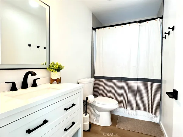 a bathroom with a bathtub and shower