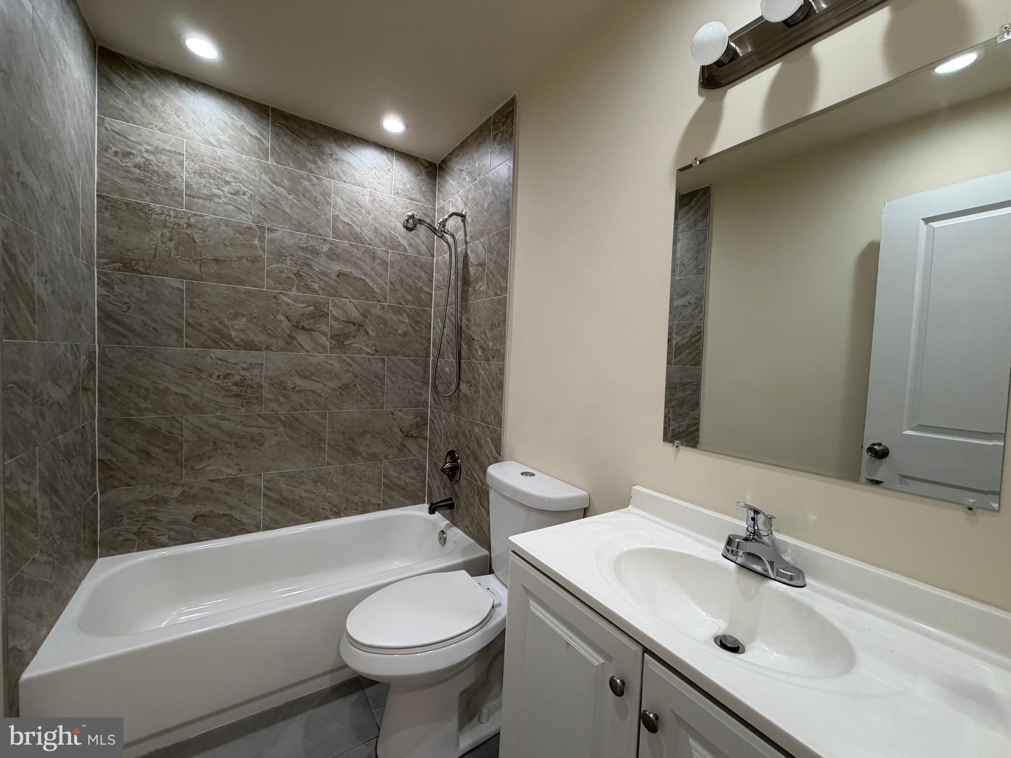 601 North Clinton Street Baltimore, MD 21205 - Photo 11 of 12 a bathroom with a sink a toilet and shower