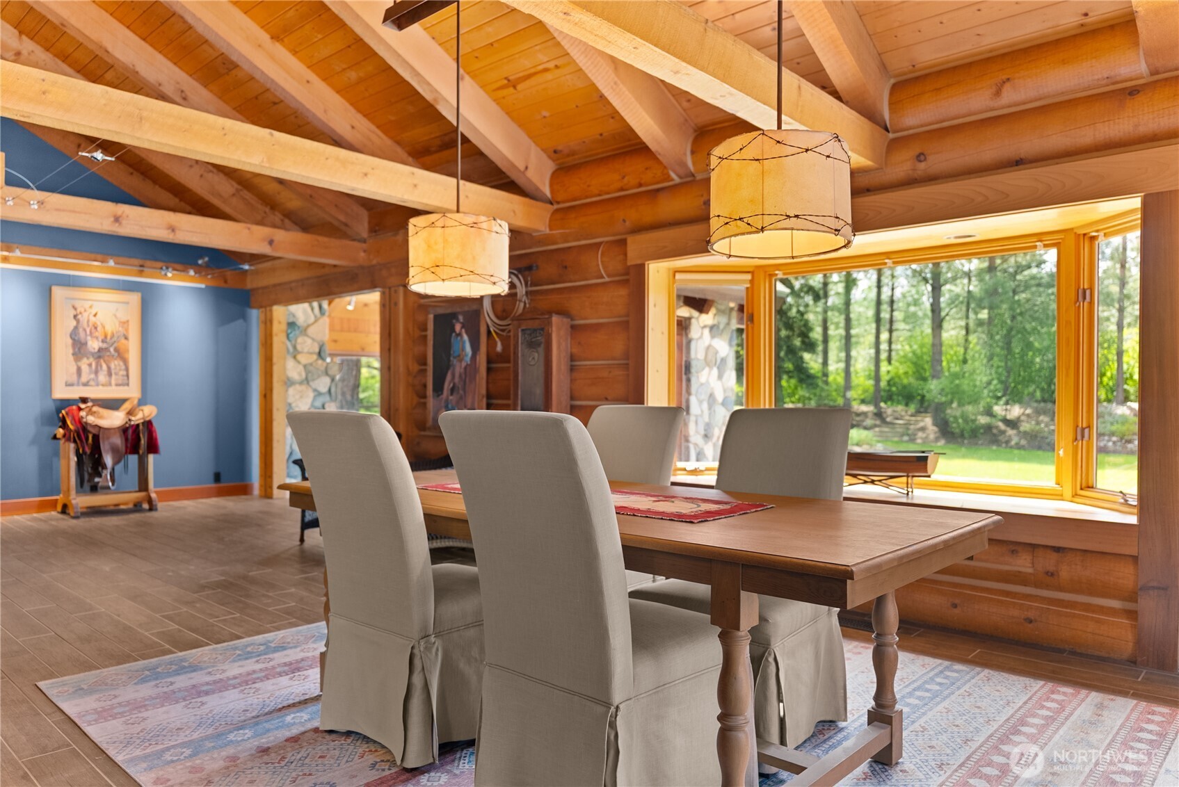 179 Wolf Creek Road Winthrop, WA 98862 - Photo 16 of 40 a view of a dining room with furniture window and outside view