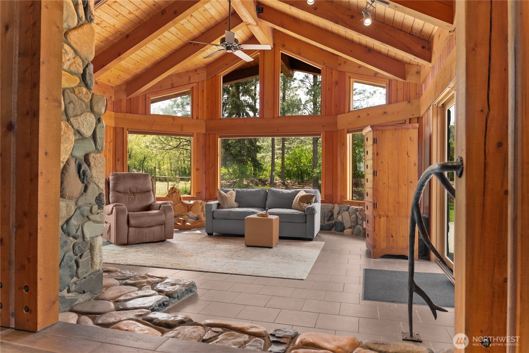 179 Wolf Creek Road Winthrop, WA 98862 - Photo 18 of 40 a living room with furniture and a large window