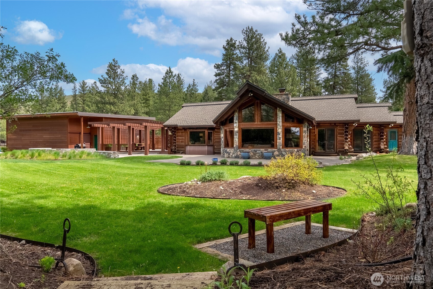 179 Wolf Creek Road Winthrop, WA 98862 - Photo 2 of 40 a view of an house with backyard space and swimming pool
