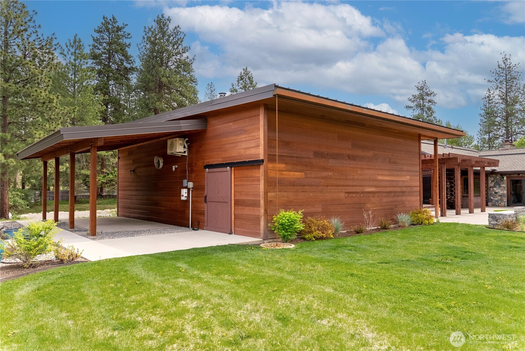 179 Wolf Creek Road Winthrop, WA 98862 - Photo 23 of 40 a backyard of a house with lots of green space