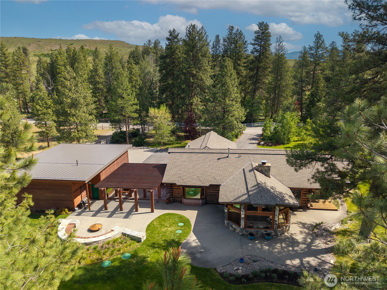 179 Wolf Creek Road Winthrop, WA 98862 - Photo 26 of 40 an aerial view of a house with garden space and street view