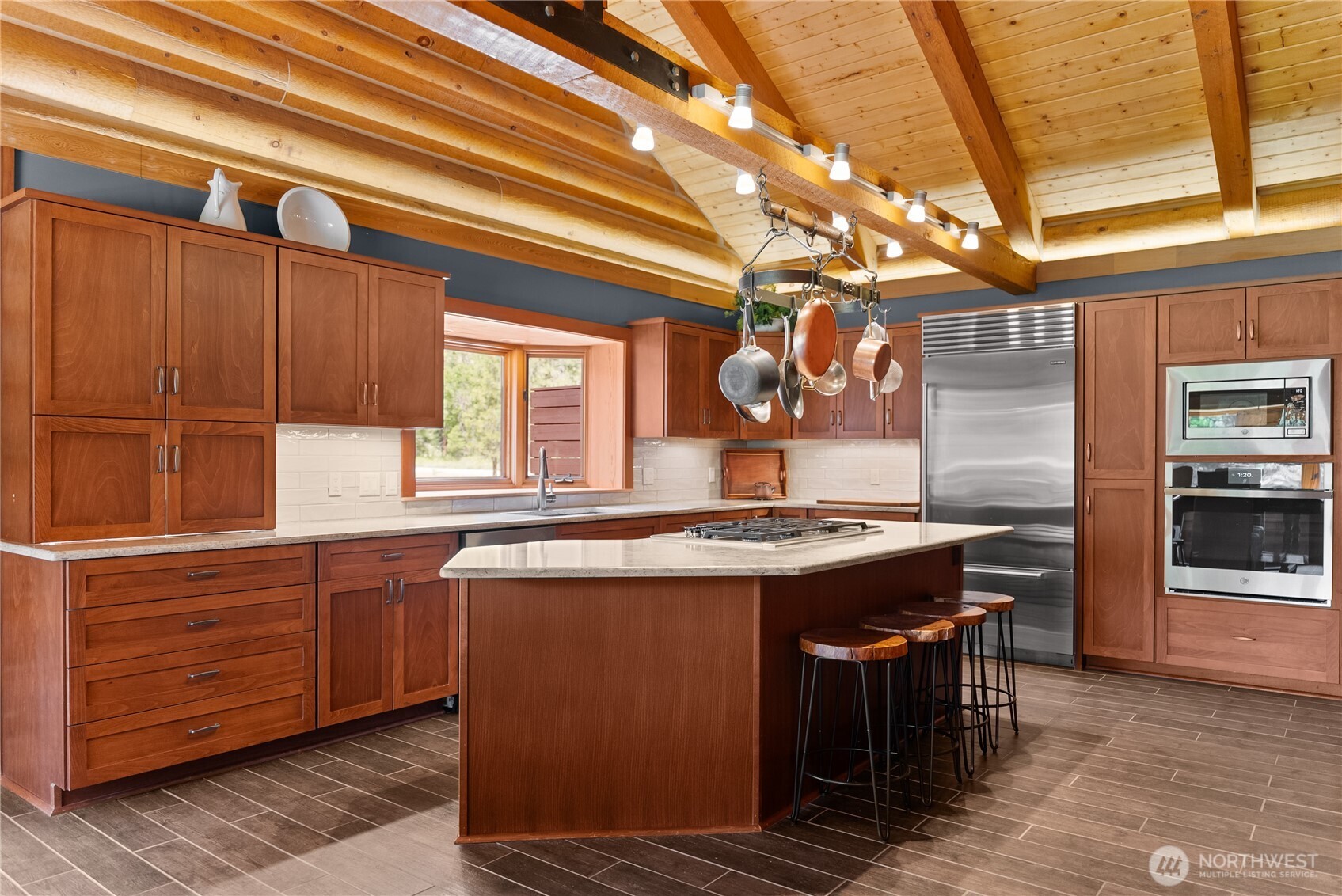 179 Wolf Creek Road Winthrop, WA 98862 - Photo 9 of 40 a kitchen with a stove and a sink