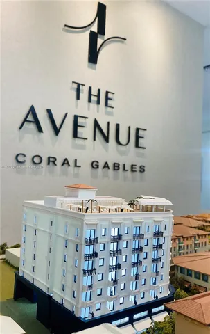 a front view of a building with a garden