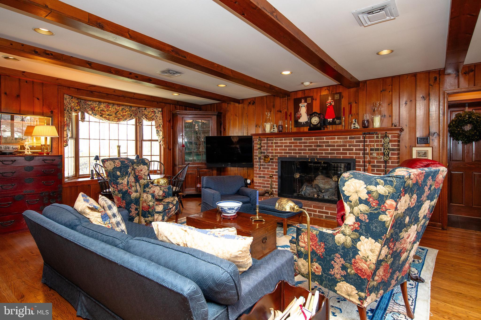 1616 Hampton Road Abington, PA 19001 - Photo 25 of 53 a living room with furniture a fireplace and a flat screen tv