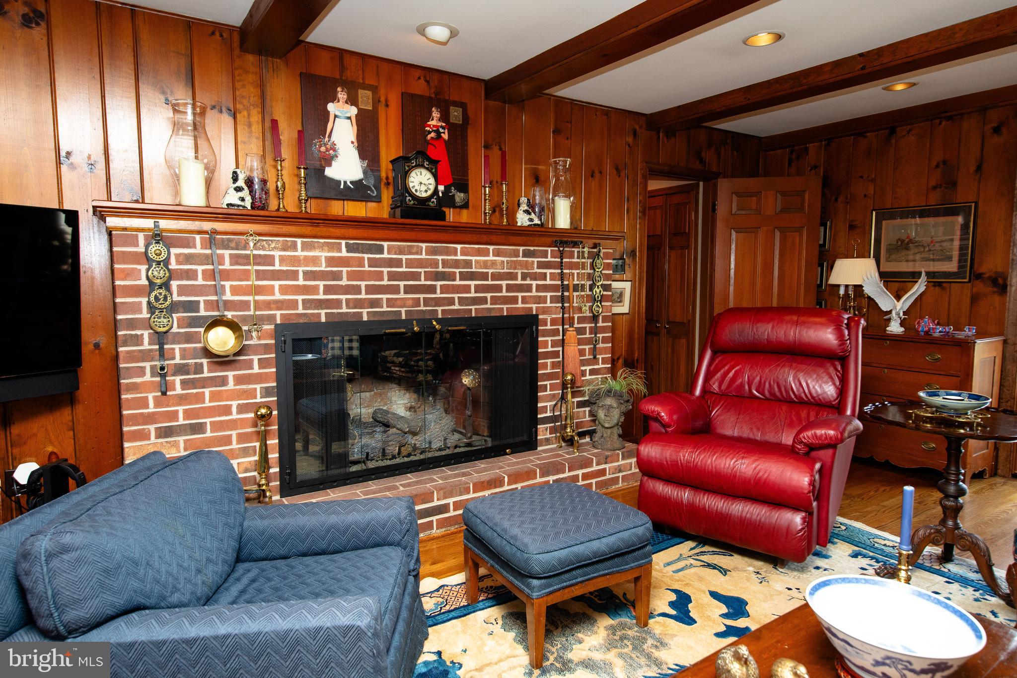 1616 Hampton Road Abington, PA 19001 - Photo 27 of 53 a living room with furniture a fireplace and a window