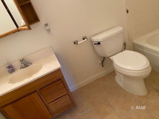 1029 West St George Avenue Ridgecrest, CA 93555 - Photo 12 of 13 a bathroom with a sink and a toilet