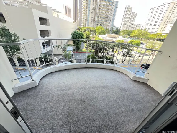a view of a balcony with an outdoor seating