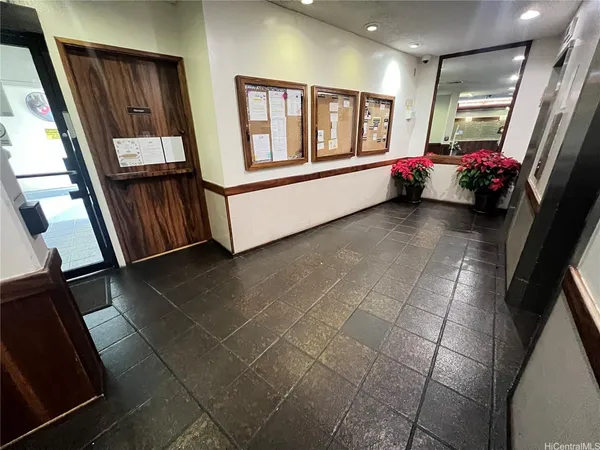 a hallway with a window and couch