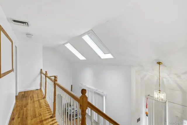 a view of a hallway with windows
