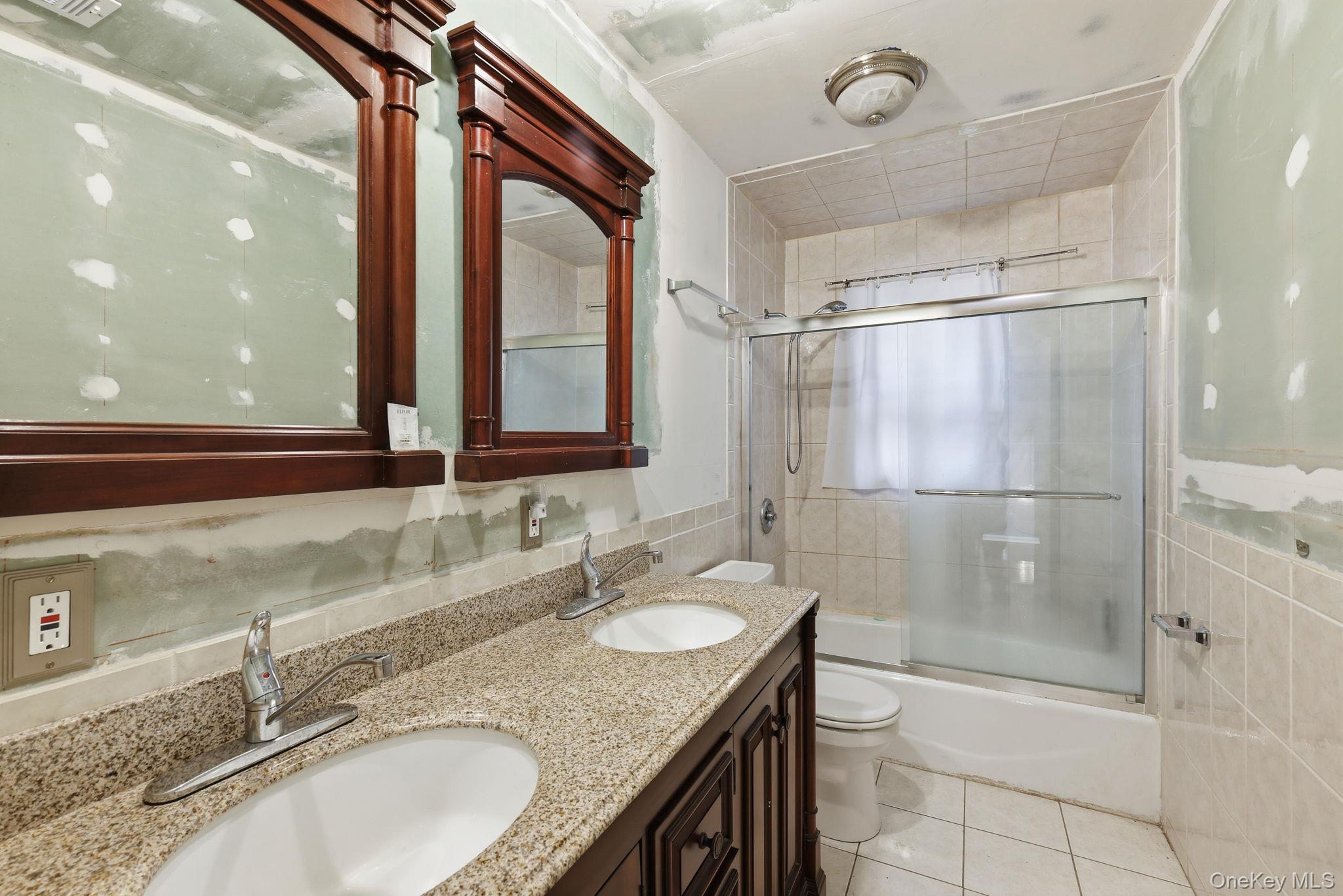 120 S Road Holmes, NY 12531 - Photo 16 of 25 a bathroom with a granite countertop sink mirror and shower