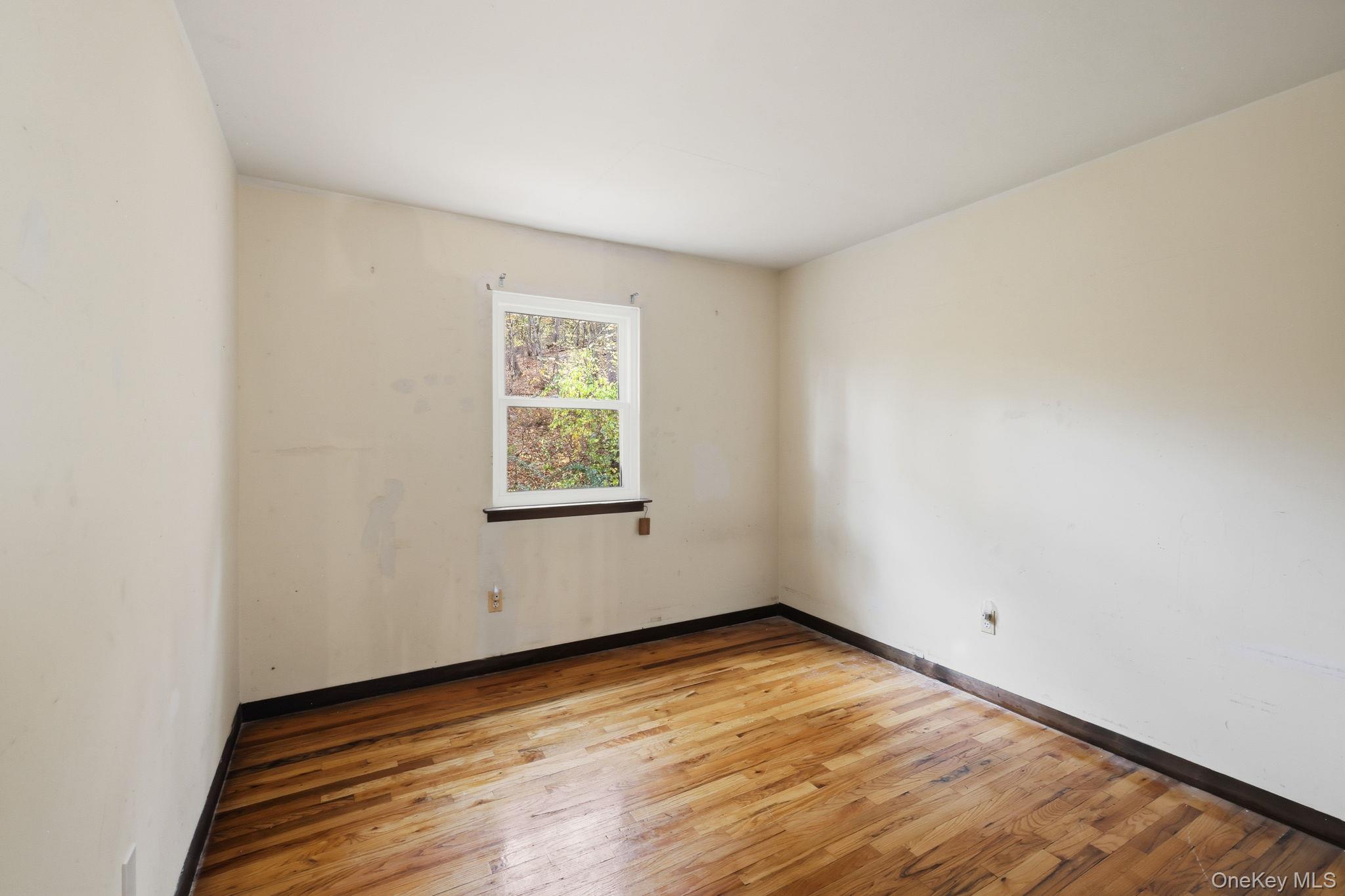 120 S Road Holmes, NY 12531 - Photo 17 of 25 an empty room with wooden floor and windows