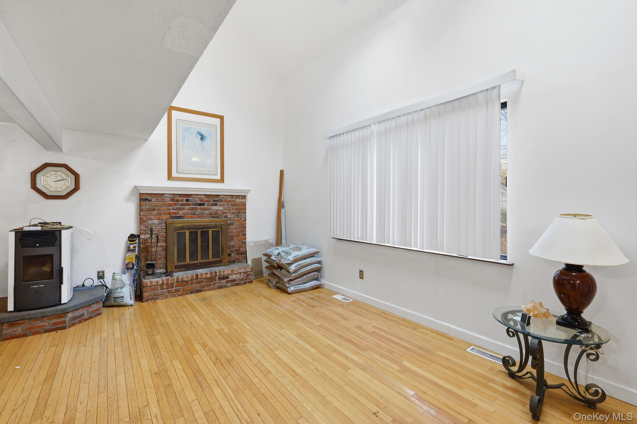 120 S Road Holmes, NY 12531 - Photo 3 of 25 a view of a livingroom with a fireplace and workspace
