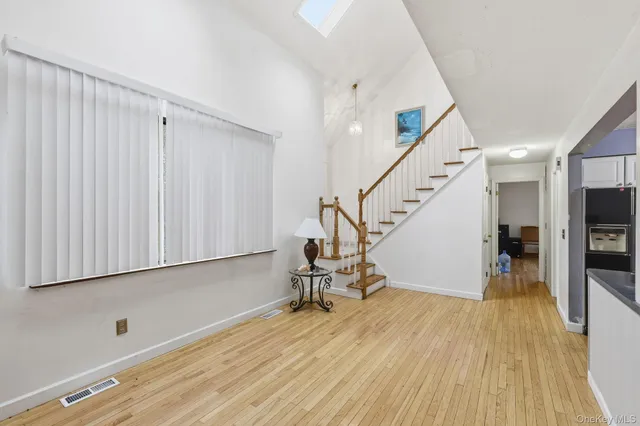 a view of entryway with wooden floor