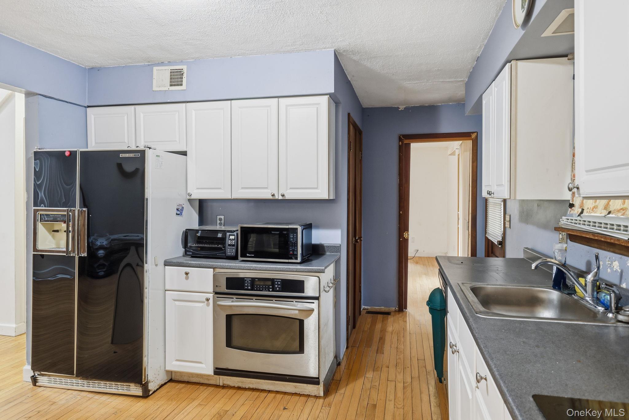 120 S Road Holmes, NY 12531 - Photo 7 of 25 a kitchen with granite countertop a refrigerator stove and sink