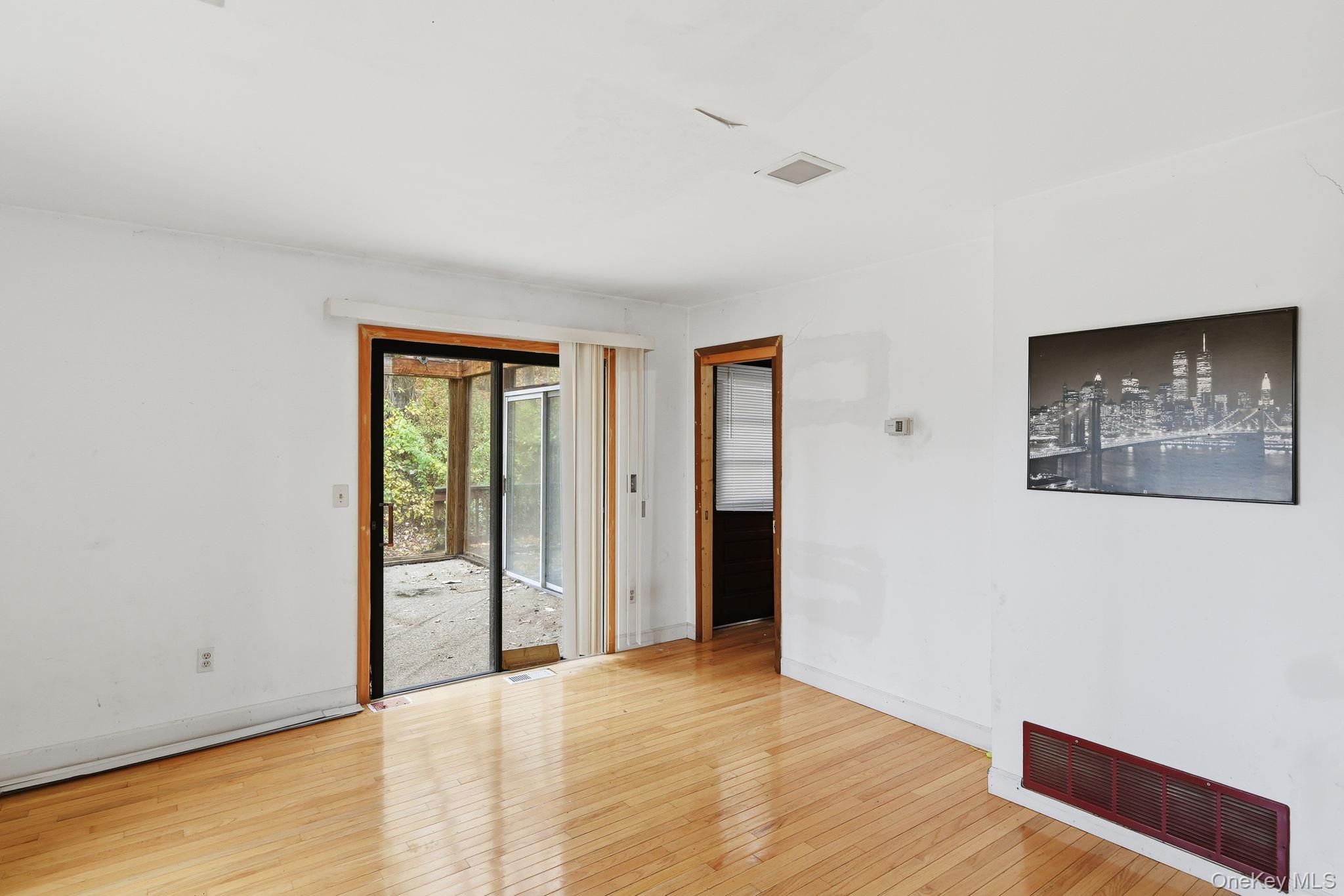 120 S Road Holmes, NY 12531 - Photo 9 of 25 a view of an empty room with wooden floor and a window