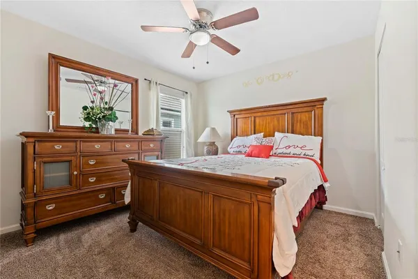 a bedroom with a bed and a dresser