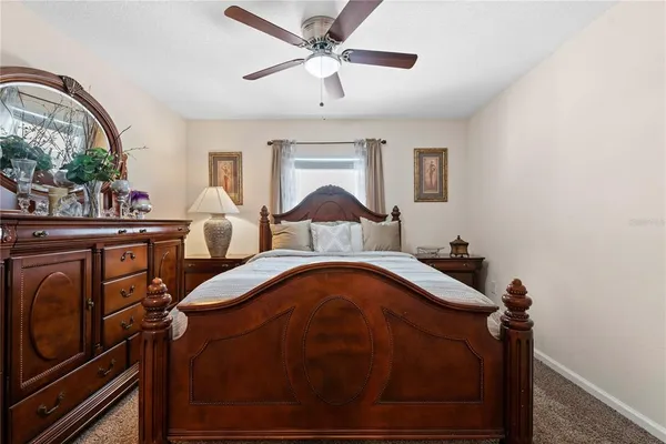 a bedroom with furniture and a window