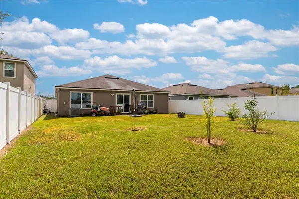 a front view of house with yard and entertaining space