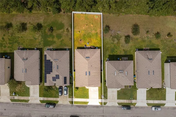 aerial view of a house with a garden