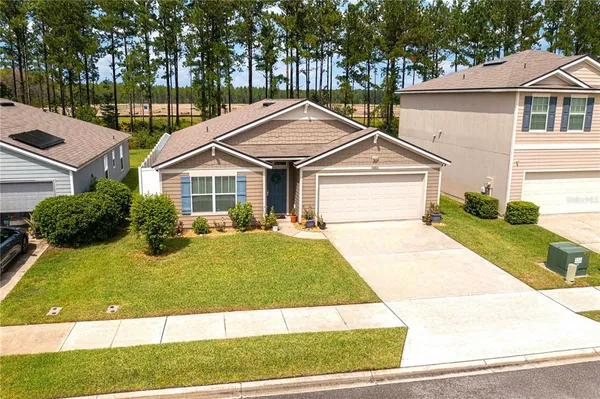 a front view of a house with a yard