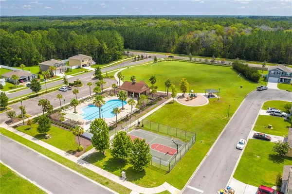 a view of a swimming pool with a yard