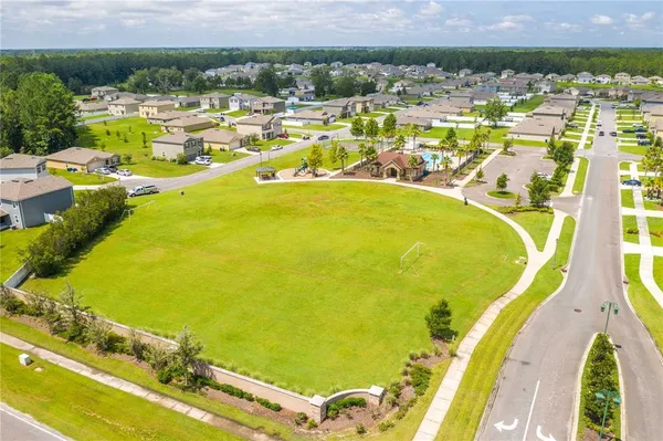 a view of a swimming pool with a table and chairs