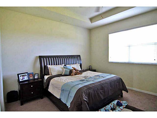 43 Southwest Squirrel Nest Way Stuart, FL 34997 - Photo 13 of 22 a bedroom with a bed and a window
