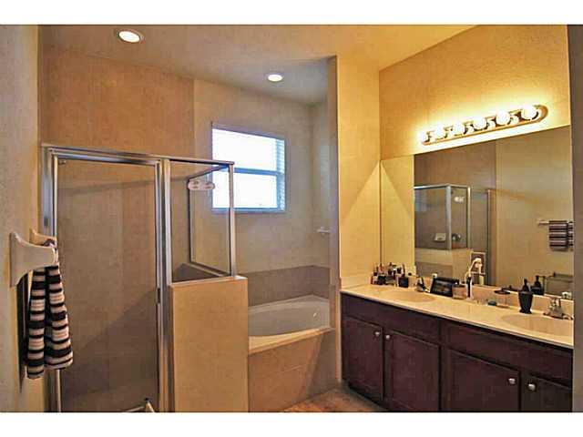 43 Southwest Squirrel Nest Way Stuart, FL 34997 - Photo 14 of 22 a bathroom with a shower sink and mirror