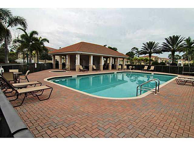 43 Southwest Squirrel Nest Way Stuart, FL 34997 - Photo 18 of 22 a view of a swimming pool with lounge chair