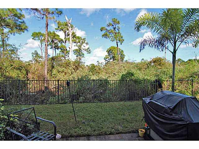 43 Southwest Squirrel Nest Way Stuart, FL 34997 - Photo 3 of 22 a view of a backyard with garden