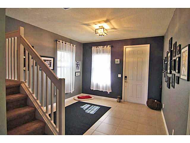 43 Southwest Squirrel Nest Way Stuart, FL 34997 - Photo 6 of 22 a living room with furniture and a chandelier