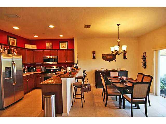 43 Southwest Squirrel Nest Way Stuart, FL 34997 - Photo 9 of 22 a view of a dining room with furniture and chandelier