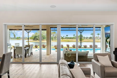 a kitchen with kitchen island granite countertop a sink cabinets and stainless steel appliances