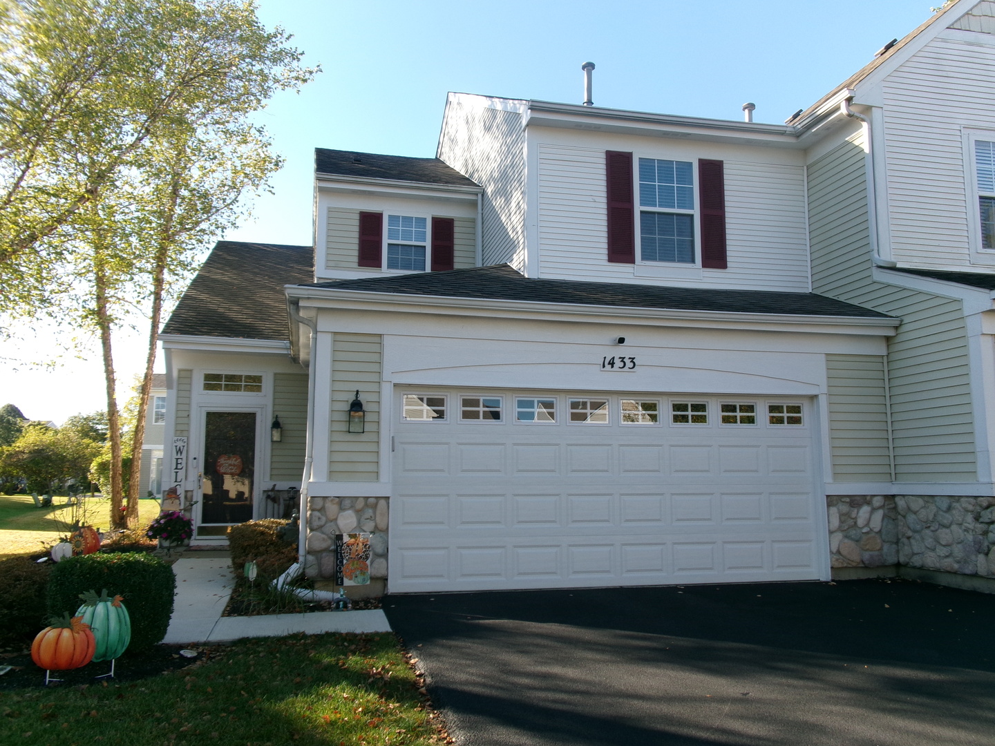 a front view of a house with a yard