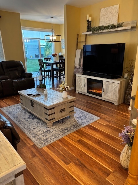 1433 White Pine Lane Bolingbrook, IL 60490 - Photo 3 of 25 a living room with furniture and a flat screen tv