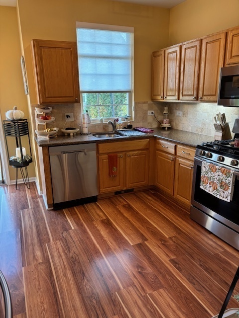 1433 White Pine Lane Bolingbrook, IL 60490 - Photo 7 of 25 a kitchen with stainless steel appliances granite countertop a stove a sink and a microwave