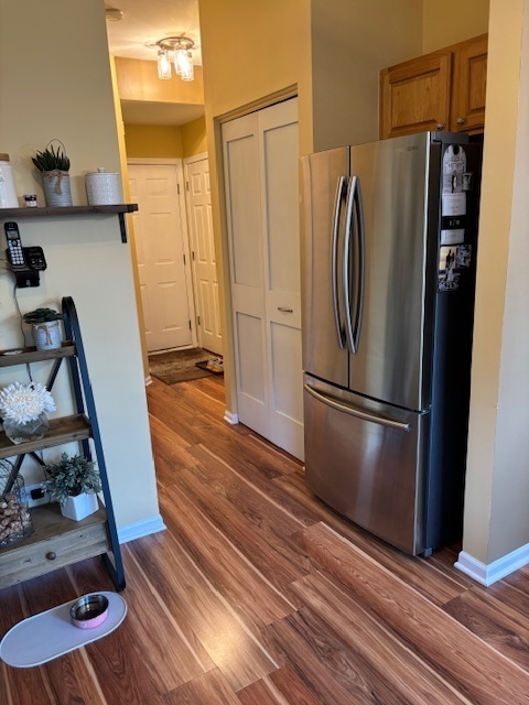 1433 White Pine Lane Bolingbrook, IL 60490 - Photo 9 of 25 a kitchen with metallic refrigerator and wooden floor