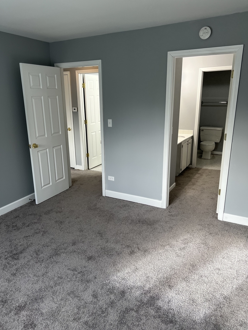 787 Wilson Avenue, Unit 10 Glen Ellyn, IL 60137 - Photo 15 of 26 a view of a livingroom with a staircase
