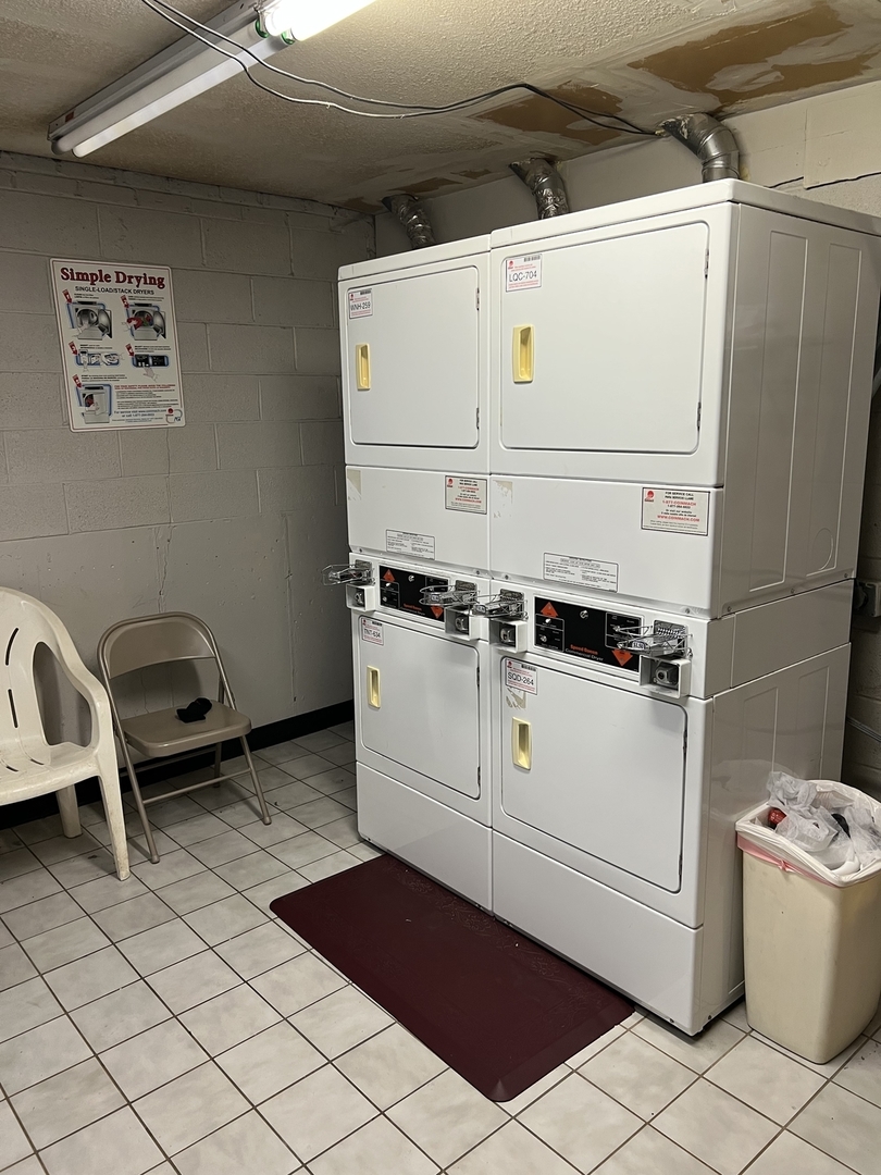 787 Wilson Avenue, Unit 10 Glen Ellyn, IL 60137 - Photo 24 of 26 a utility room with dryer and washer
