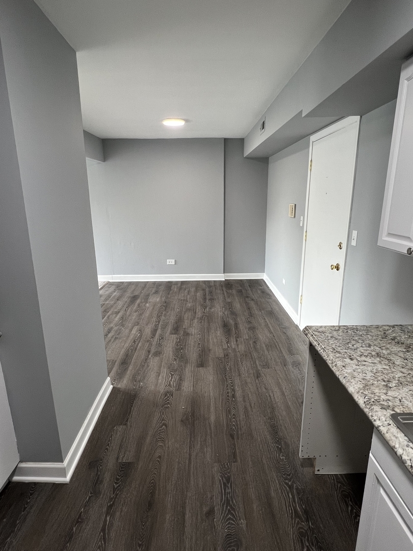 787 Wilson Avenue, Unit 10 Glen Ellyn, IL 60137 - Photo 9 of 26 a view of wooden floor and staircase in a room