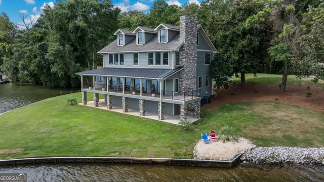 a view of a house with a garden and swimming pool